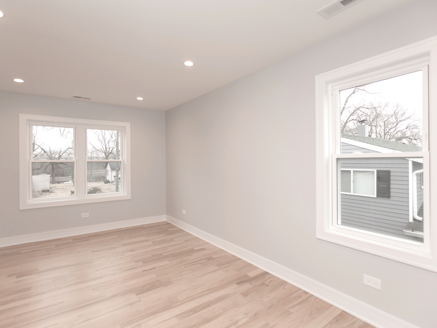 6310 Hilly Way Cary, IL 60013 - Photo 22 of 67 an empty room with wooden floor and windows