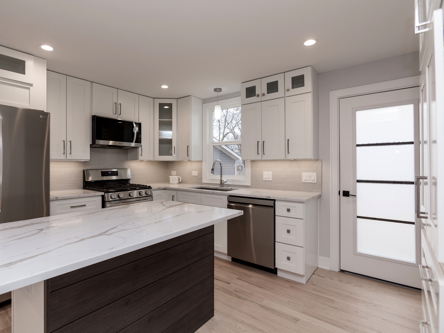 6310 Hilly Way Cary, IL 60013 - Photo 4 of 67 a kitchen with a refrigerator and a stove top oven