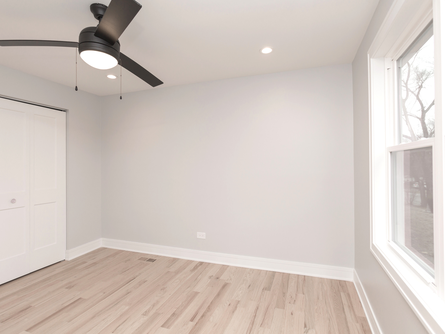 6310 Hilly Way Cary, IL 60013 - Photo 43 of 67 a view of an empty room with a window and wooden floor