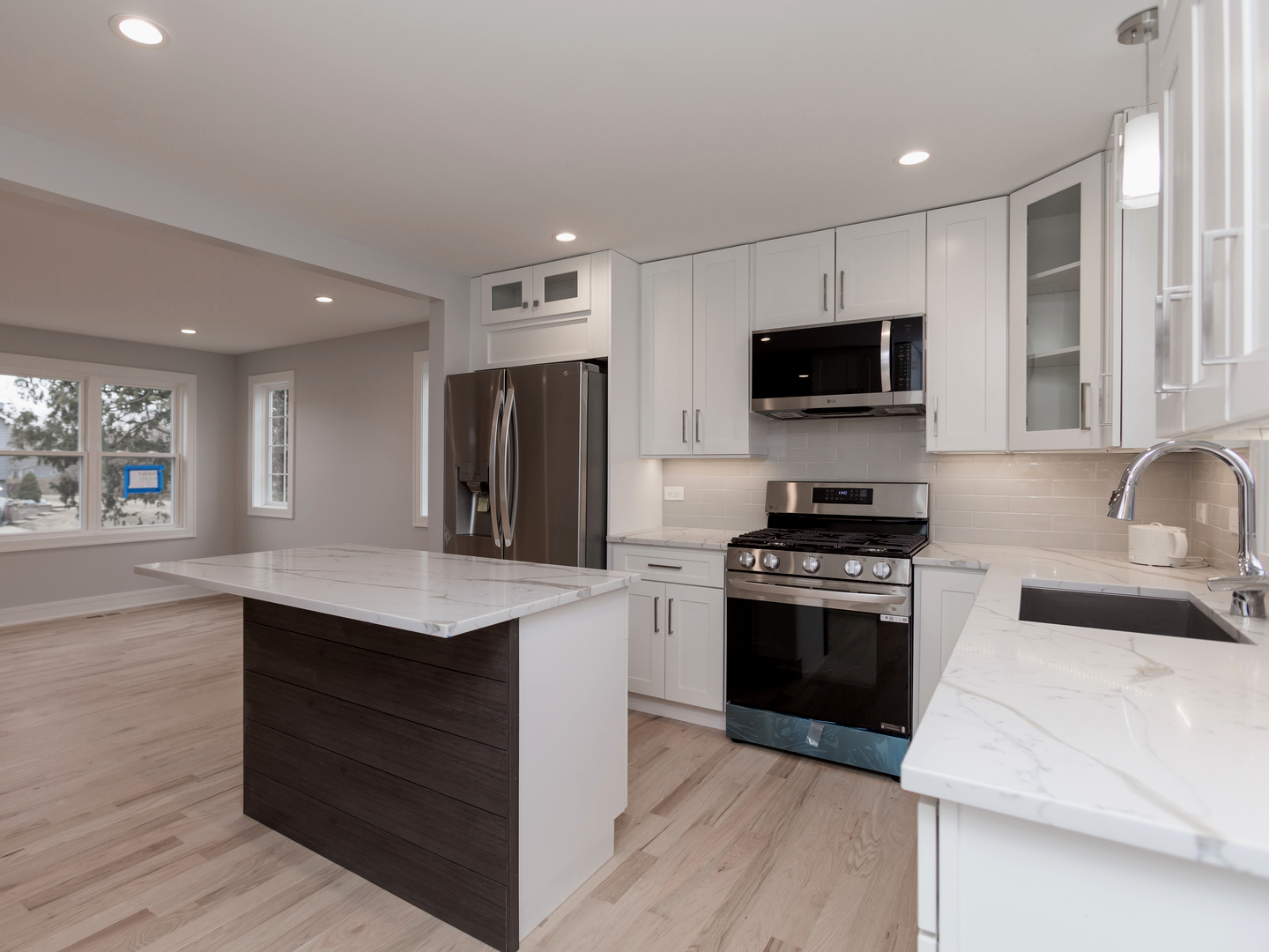 6310 Hilly Way Cary, IL 60013 - Photo 5 of 67 a kitchen with stainless steel appliances kitchen island granite countertop a stove a sink and a refrigerator