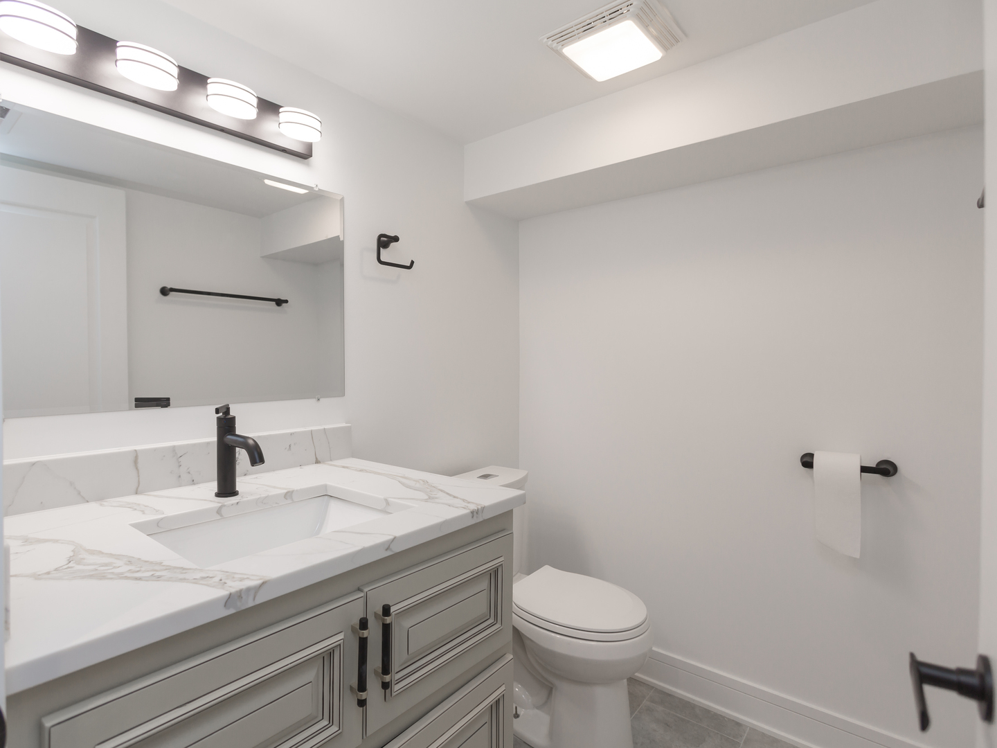6310 Hilly Way Cary, IL 60013 - Photo 55 of 67 a bathroom with a sink a toilet and mirror