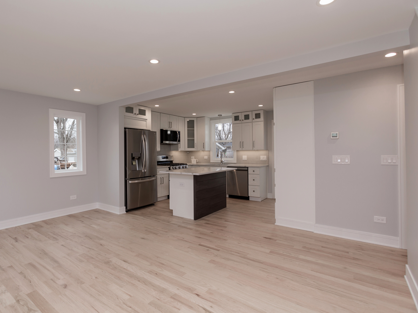 6310 Hilly Way Cary, IL 60013 - Photo 10 of 67 a large kitchen with a lot of counter top space stainless steel appliances and a window