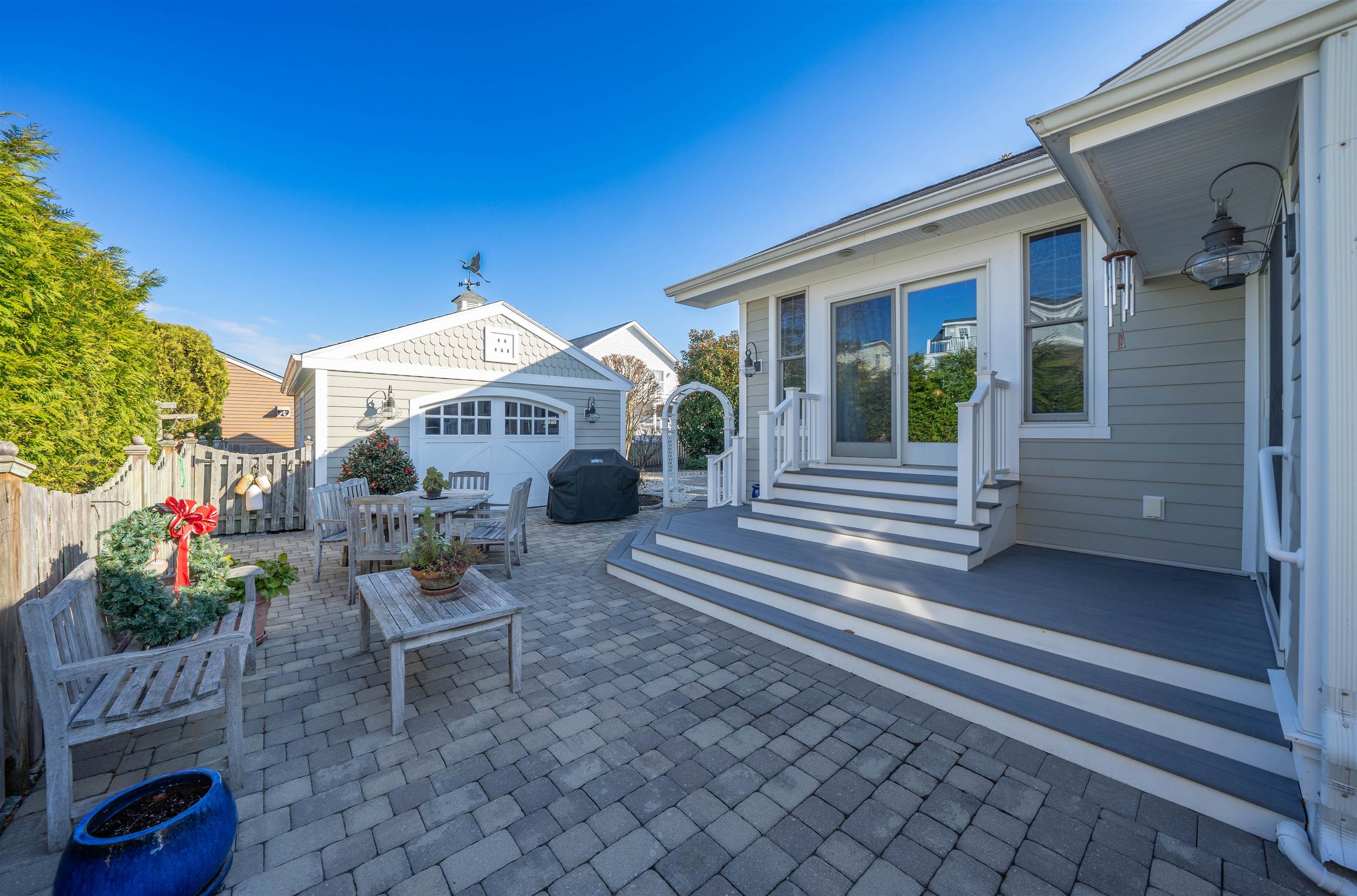 273 60th Street Avalon, NJ 08202 - Photo 20 of 33 a front view of a house with porch and sitting area