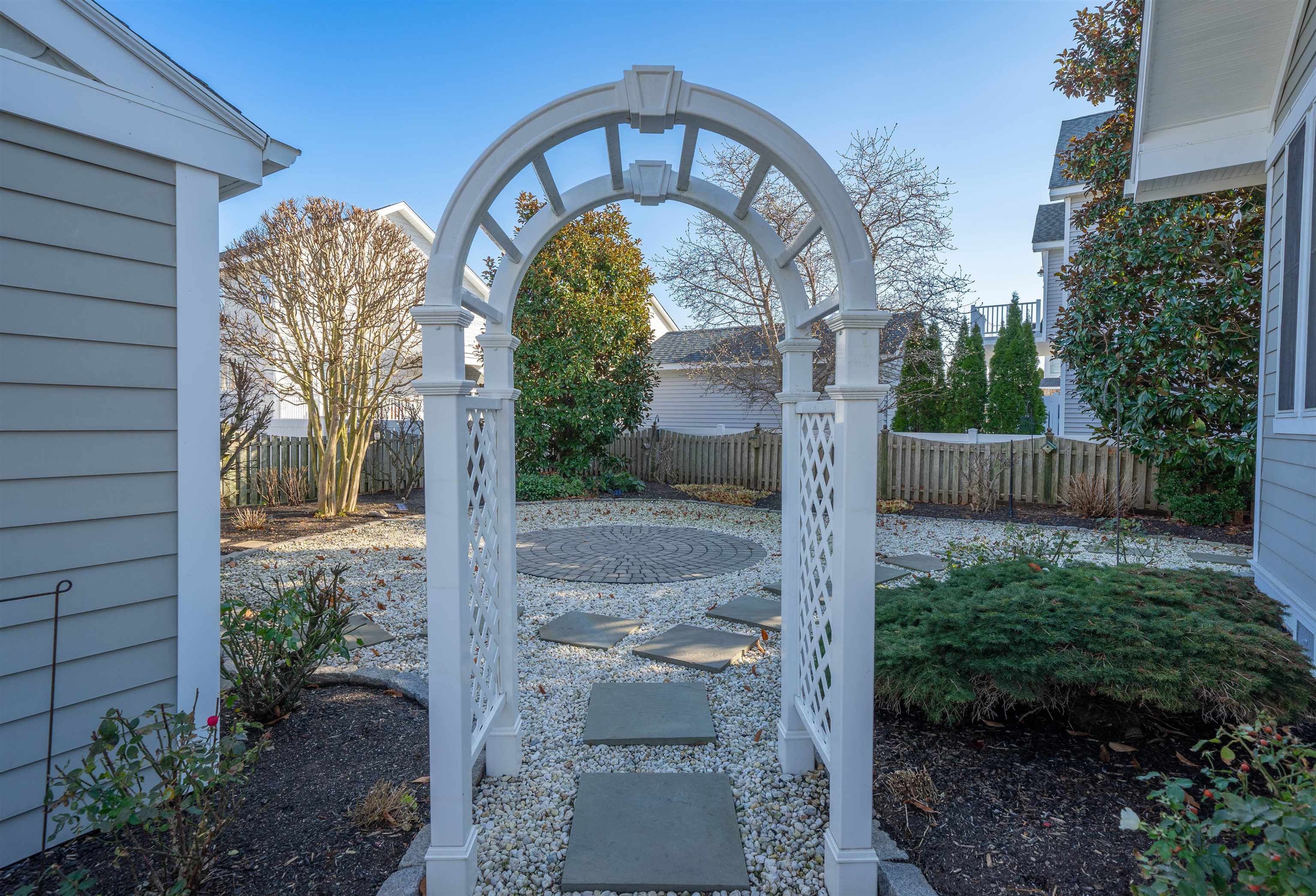 273 60th Street Avalon, NJ 08202 - Photo 22 of 33 a front view of a house with garden