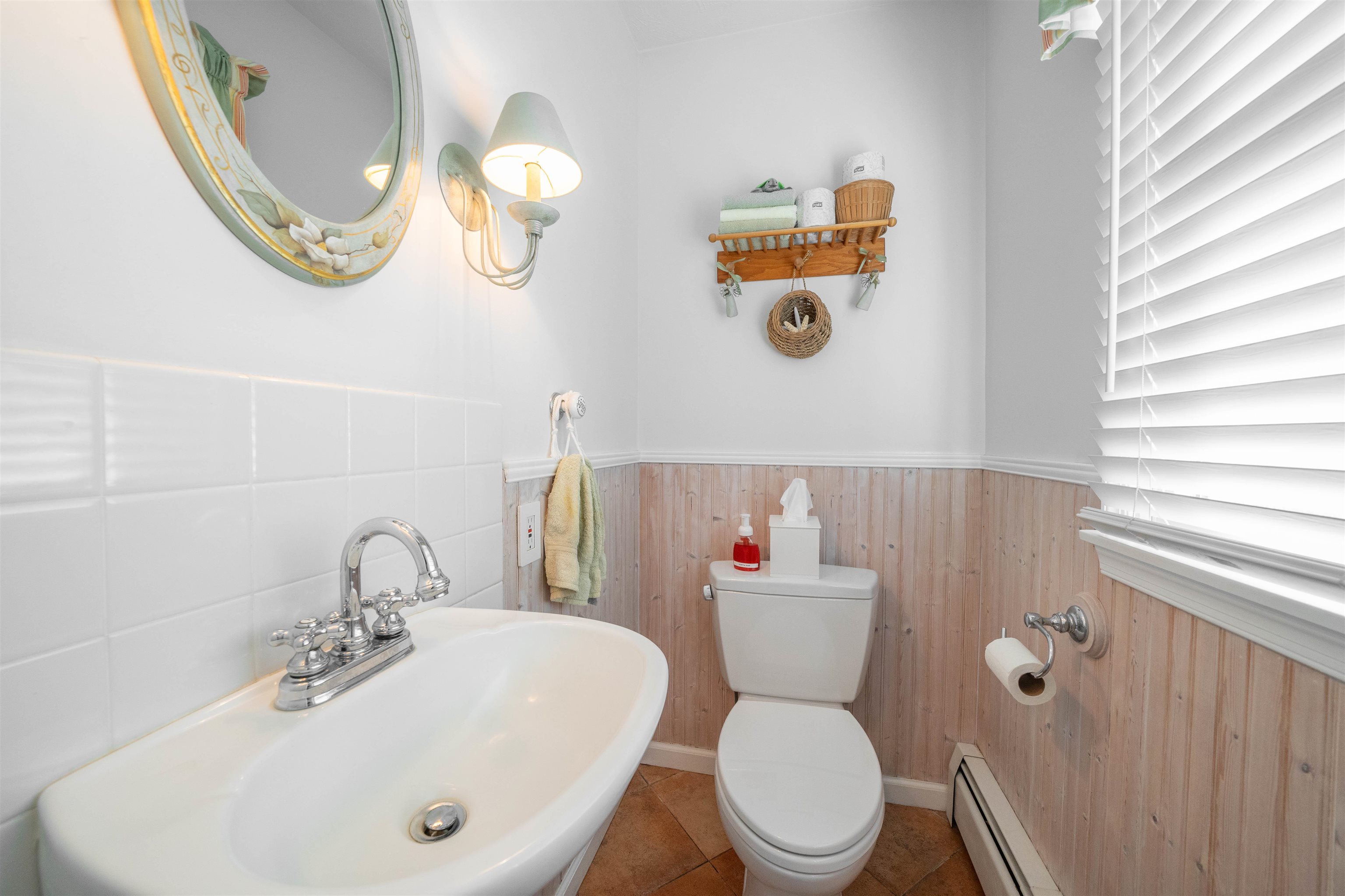 273 60th Street Avalon, NJ 08202 - Photo 10 of 33 a bathroom with a sink a toilet and a mirror