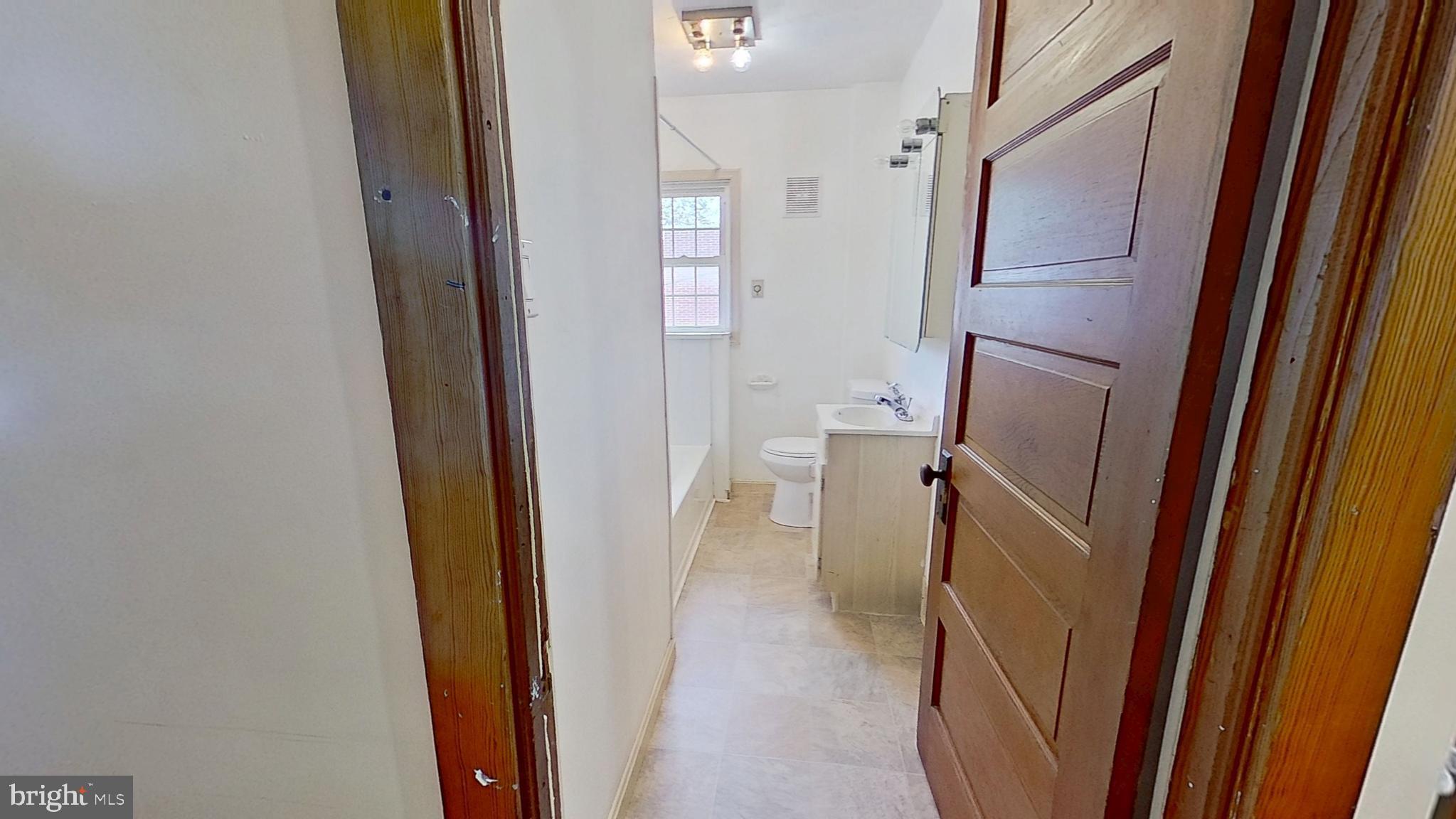 607 3rd Street Hanover, PA 17331 - Photo 12 of 12 a view of a bathroom from a hallway