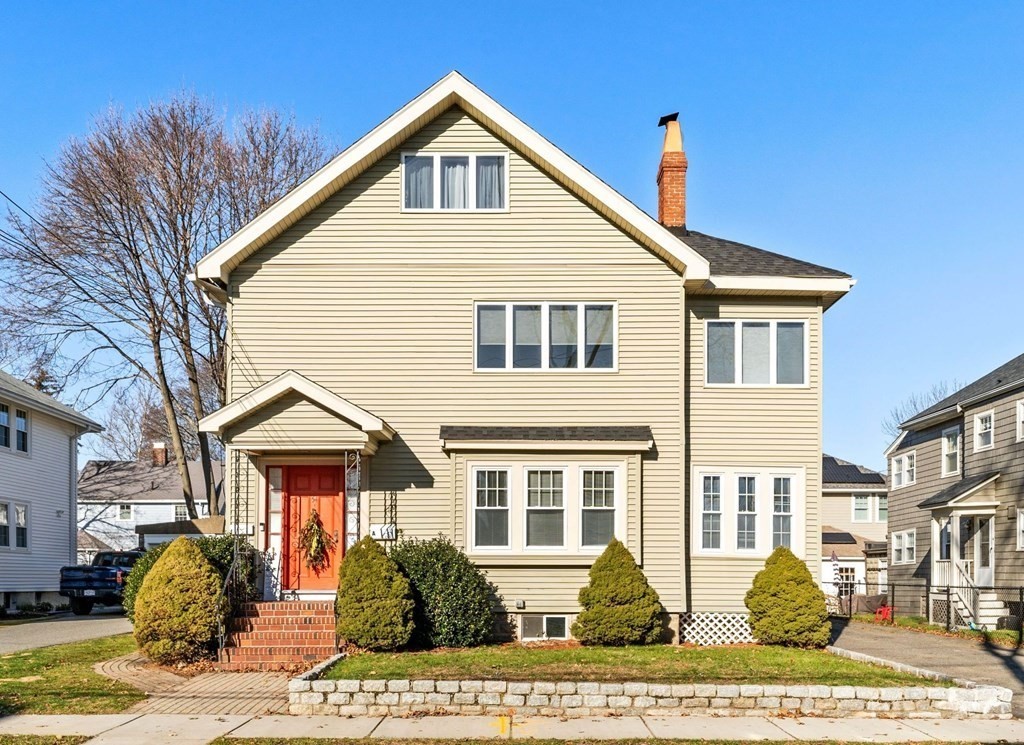 a front view of a house with a yard