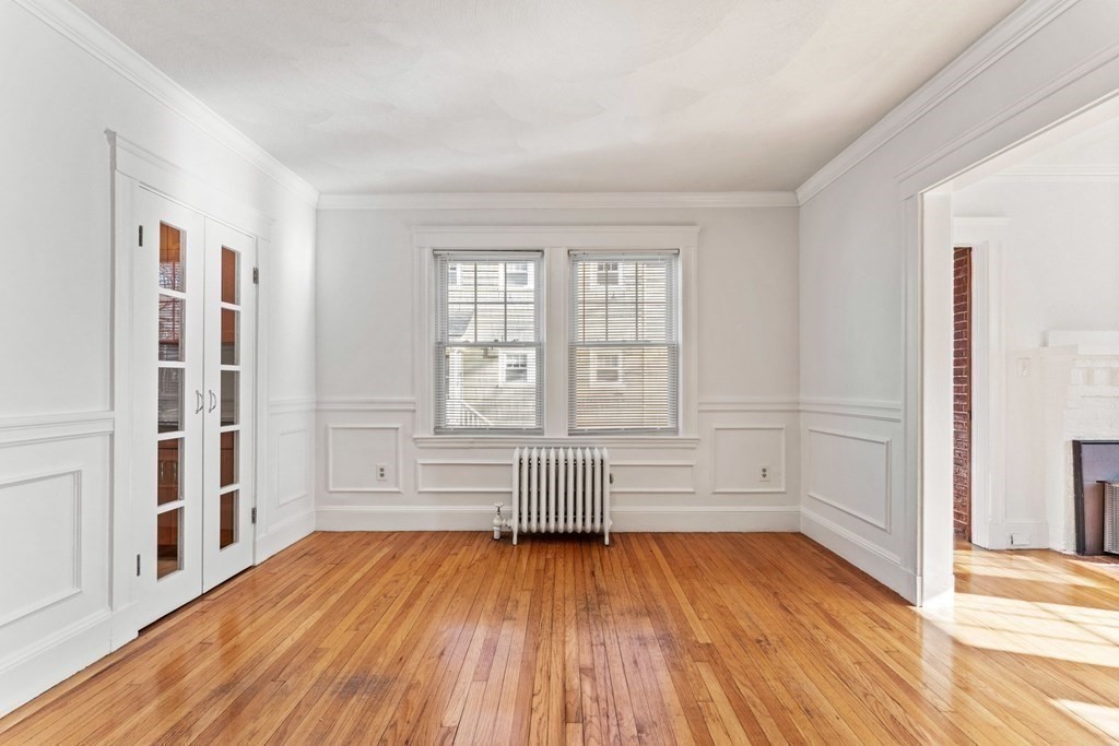 54 Chester Road, Unit 1 Belmont, MA 02478 - Photo 11 of 31 wooden floor in an empty room with a window