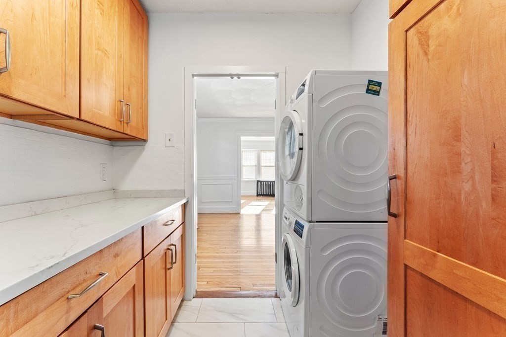 54 Chester Road, Unit 1 Belmont, MA 02478 - Photo 14 of 31 a utility room with dryer and washer