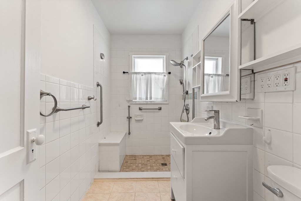 54 Chester Road, Unit 1 Belmont, MA 02478 - Photo 25 of 31 a bathroom with a sink toilet and shower