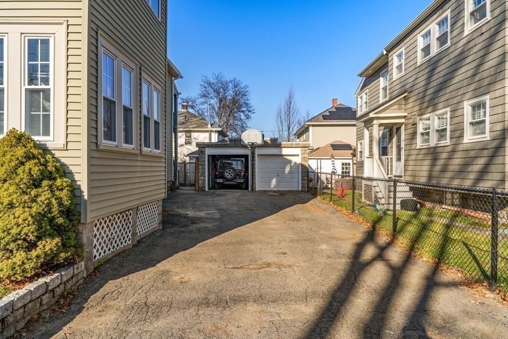 54 Chester Road, Unit 1 Belmont, MA 02478 - Photo 29 of 31 a view of a house with backyard and sitting area