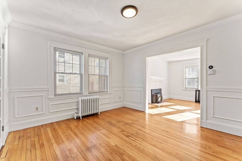 54 Chester Road, Unit 1 Belmont, MA 02478 - Photo 10 of 31 wooden floor in an empty room with a window