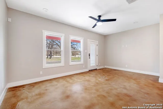 a view of an empty room with a window