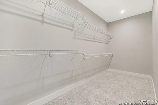 a view of a room with racks on the wall
