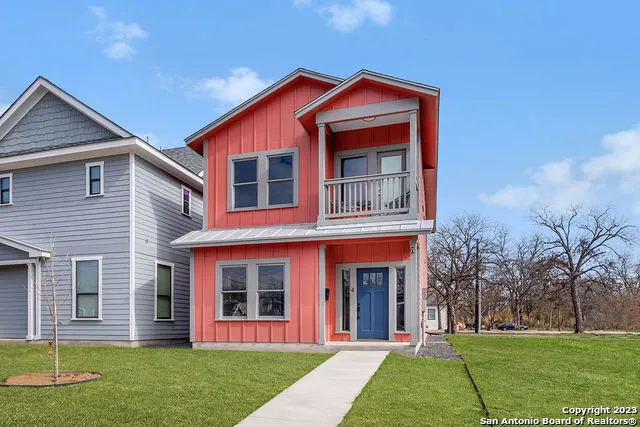 front view of a house with a yard