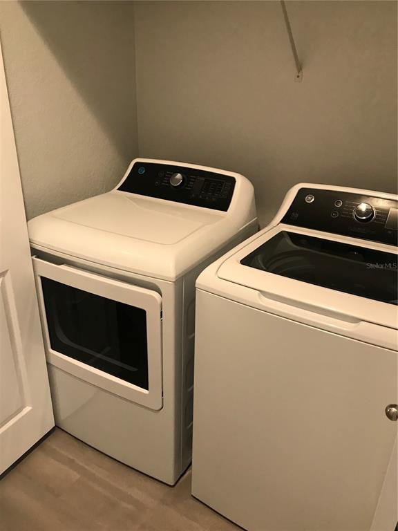 5122 Northridge Road, Unit 306 Sarasota, FL 34238 - Photo 11 of 21 a utility room with dryer and washer