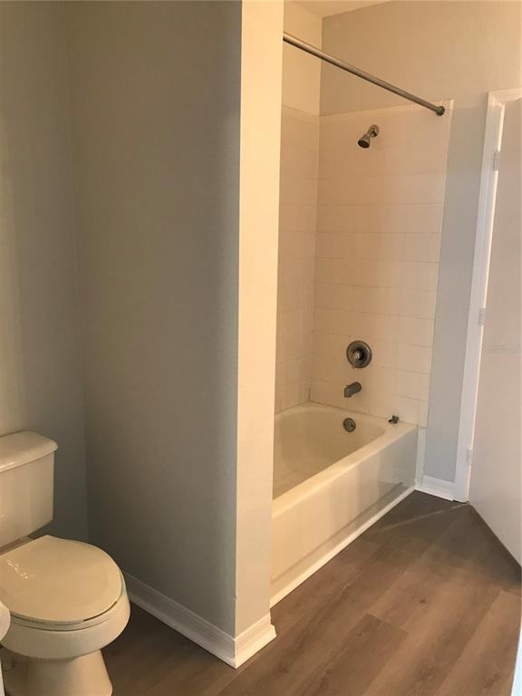5122 Northridge Road, Unit 306 Sarasota, FL 34238 - Photo 14 of 21 a white toilet sitting next to a bath tub