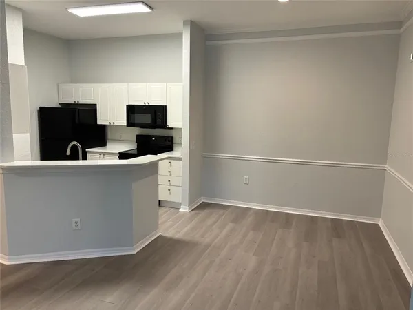 a kitchen with stainless steel appliances a refrigerator and a sink