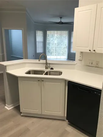 a kitchen with a sink and a window