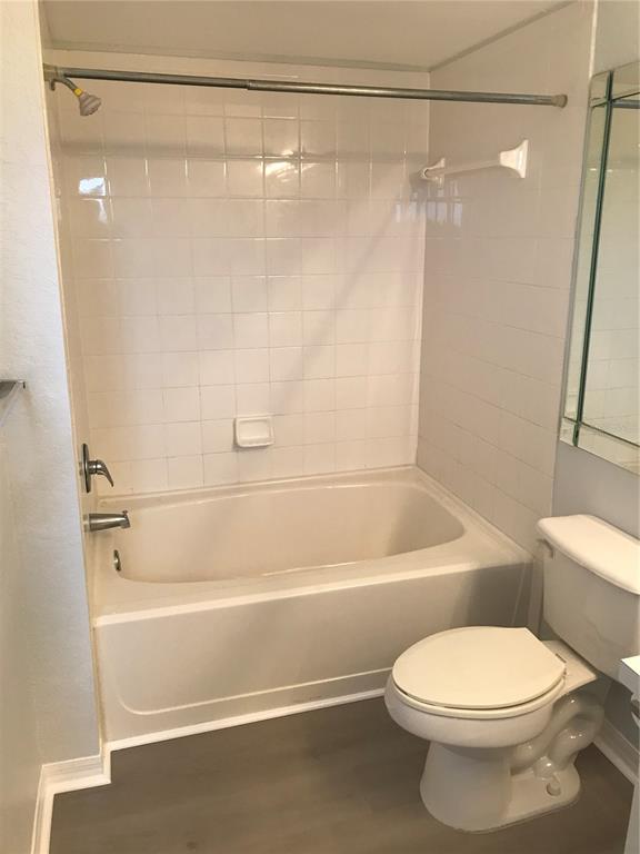 5122 Northridge Road, Unit 306 Sarasota, FL 34238 - Photo 10 of 21 a bathroom with a toilet and a shower