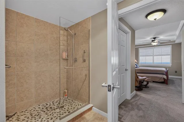 a bathroom with a shower and a sink