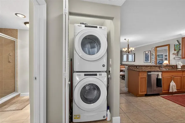 a view of a swimming pool with a bench and trees in the background