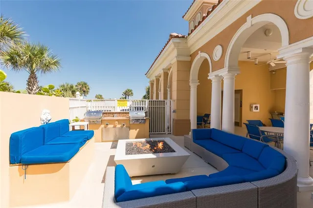 a view of a swimming pool and an outdoor seating