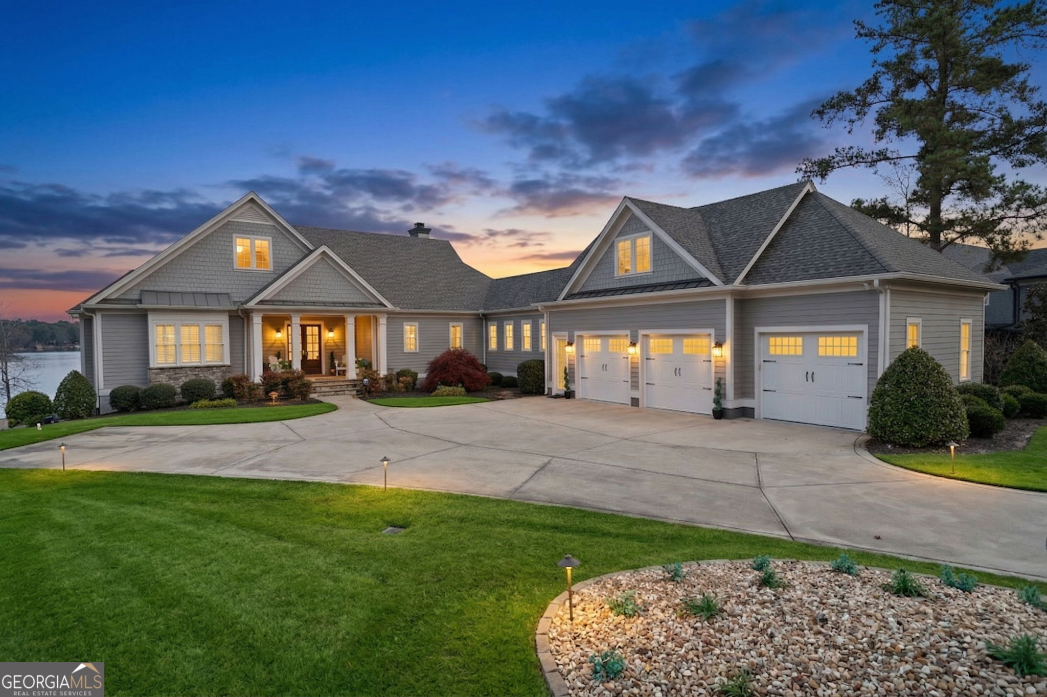 a front view of a house with a garden and porch