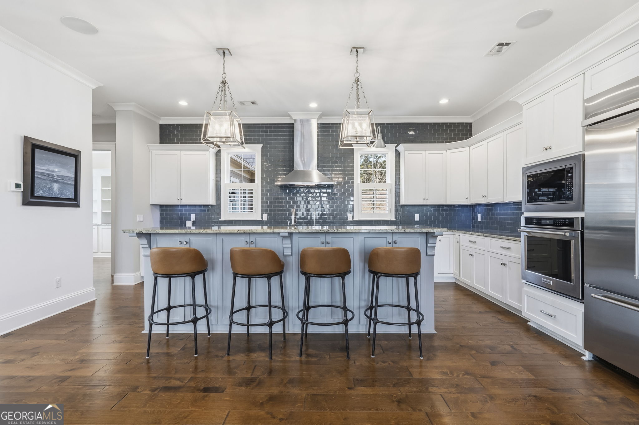 1060 Rdg Grv Court Greensboro, GA 30642 - Photo 14 of 68 a kitchen with stainless steel appliances kitchen island granite countertop a table chairs and a refrigerator