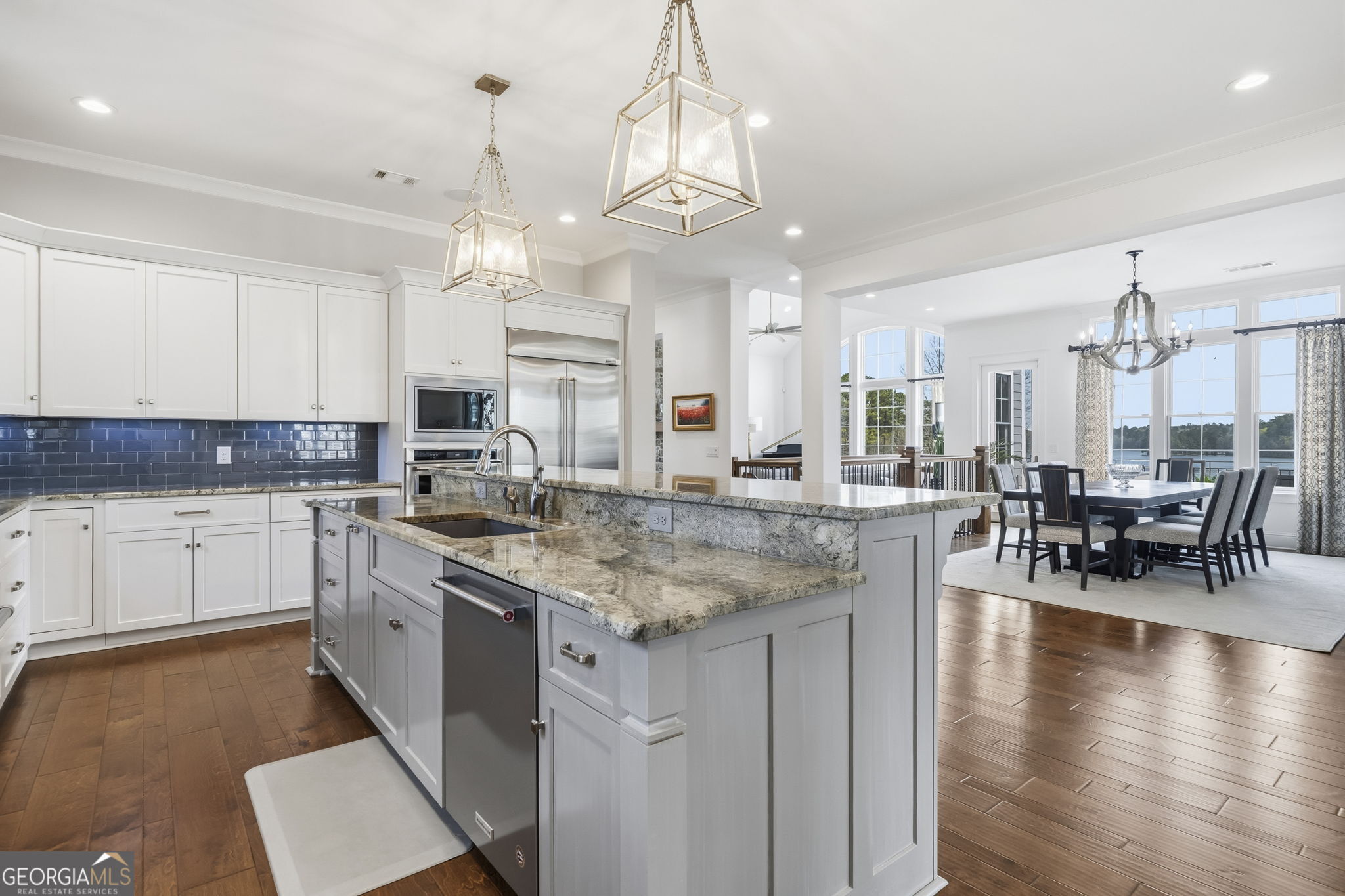 1060 Rdg Grv Court Greensboro, GA 30642 - Photo 17 of 68 a kitchen with stainless steel appliances granite countertop counter space a sink cabinets and wooden floor