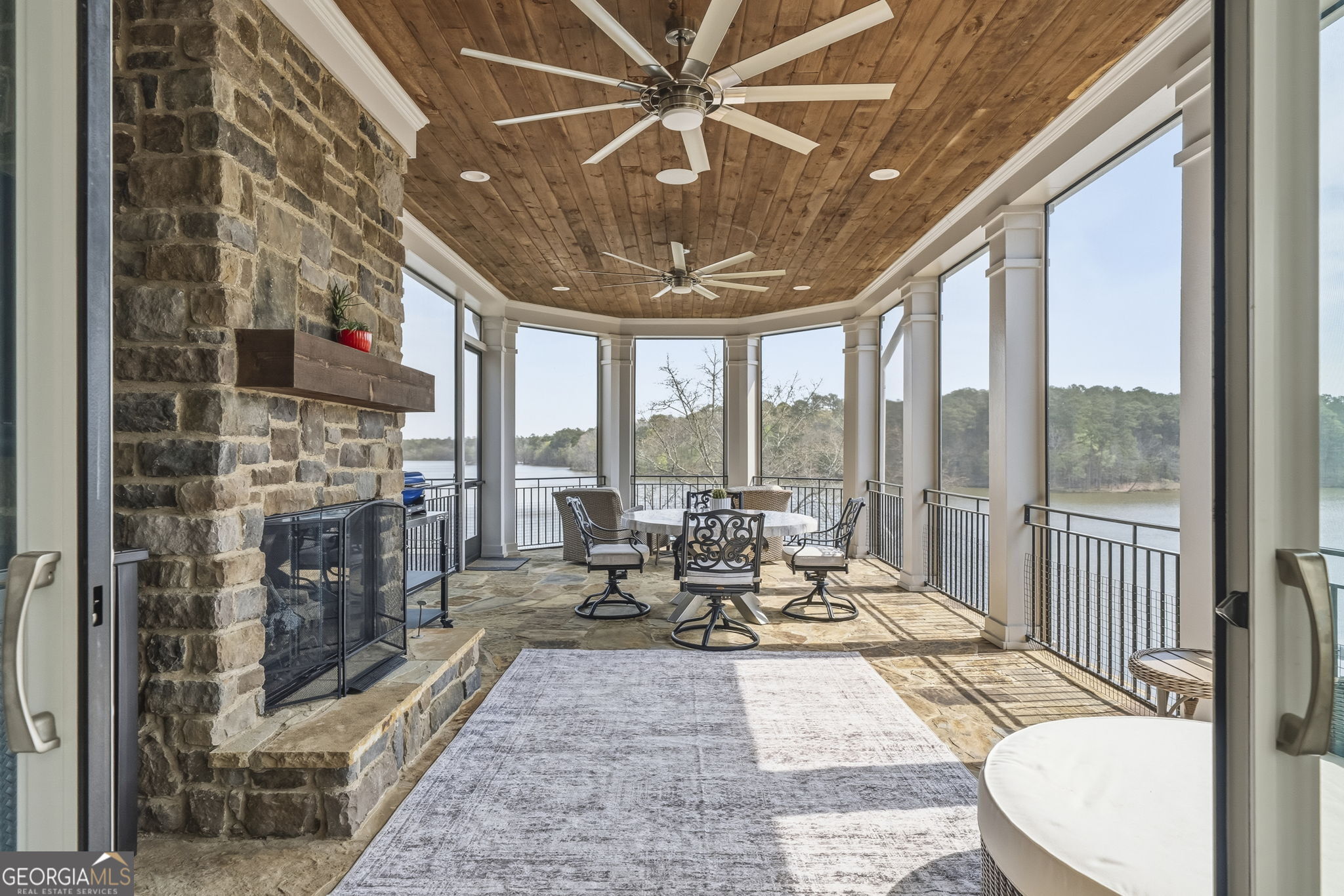 1060 Rdg Grv Court Greensboro, GA 30642 - Photo 22 of 68 a living room with fireplace furniture and a floor to ceiling window