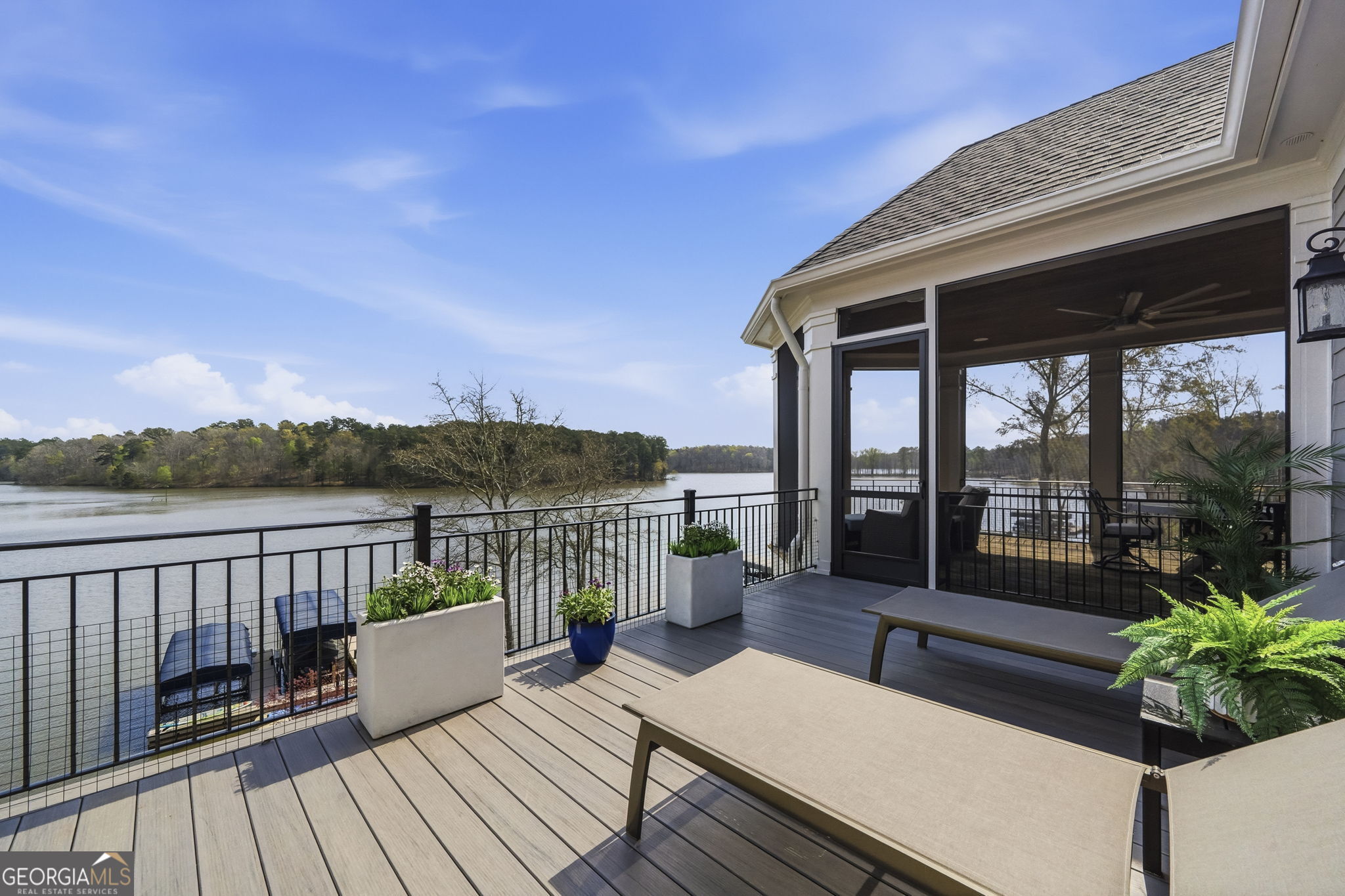 1060 Rdg Grv Court Greensboro, GA 30642 - Photo 27 of 68 a view of a balcony with chairs and wooden floor