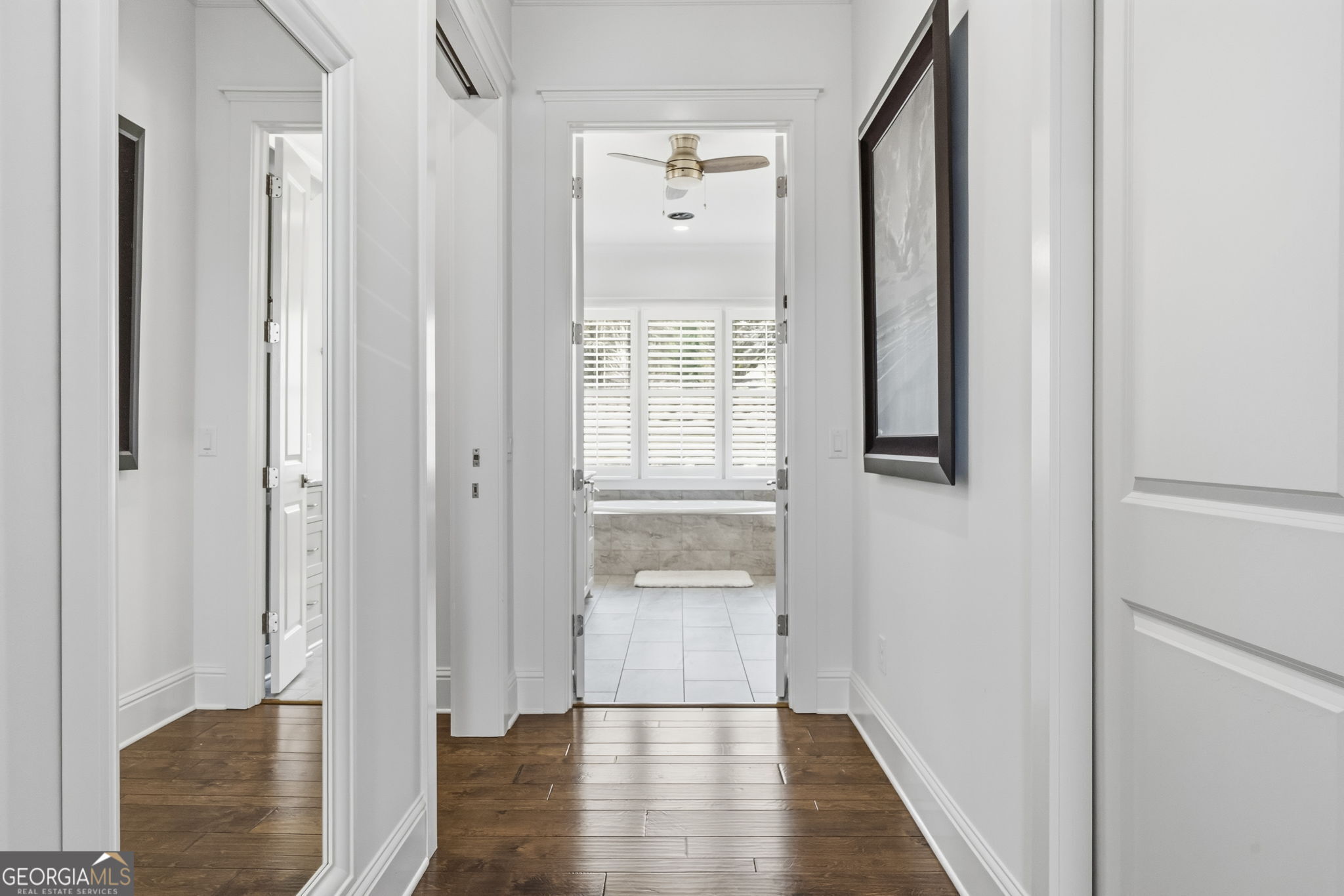 1060 Rdg Grv Court Greensboro, GA 30642 - Photo 32 of 68 a view of a hallway with wooden floor and front door