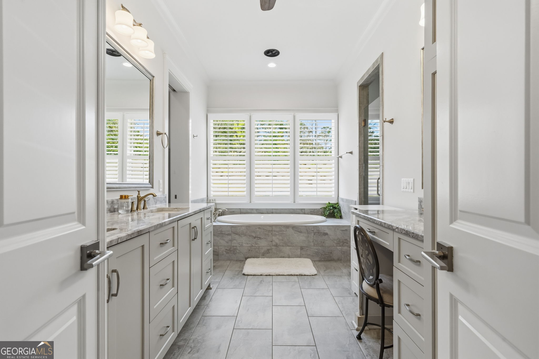 1060 Rdg Grv Court Greensboro, GA 30642 - Photo 33 of 68 a spacious bathroom with a tub sink and mirror