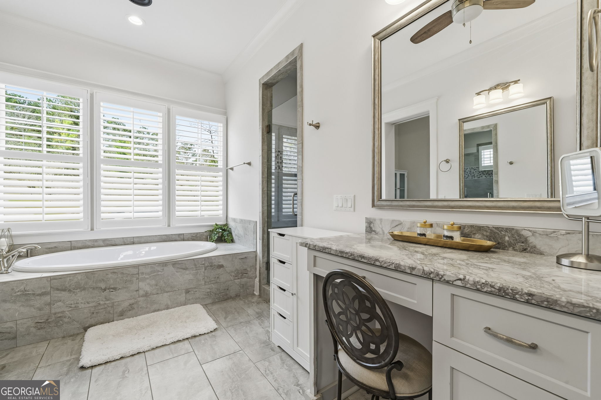 1060 Rdg Grv Court Greensboro, GA 30642 - Photo 34 of 68 a spacious bathroom with a granite countertop tub sink and mirror