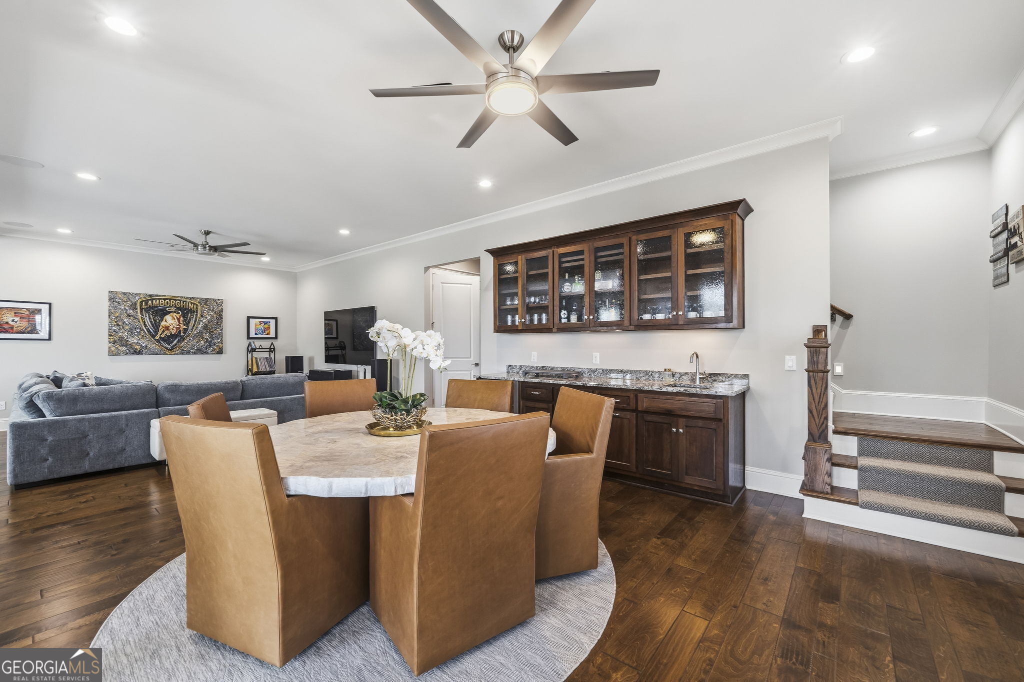 1060 Rdg Grv Court Greensboro, GA 30642 - Photo 38 of 68 a living room with furniture a flat screen tv and kitchen view