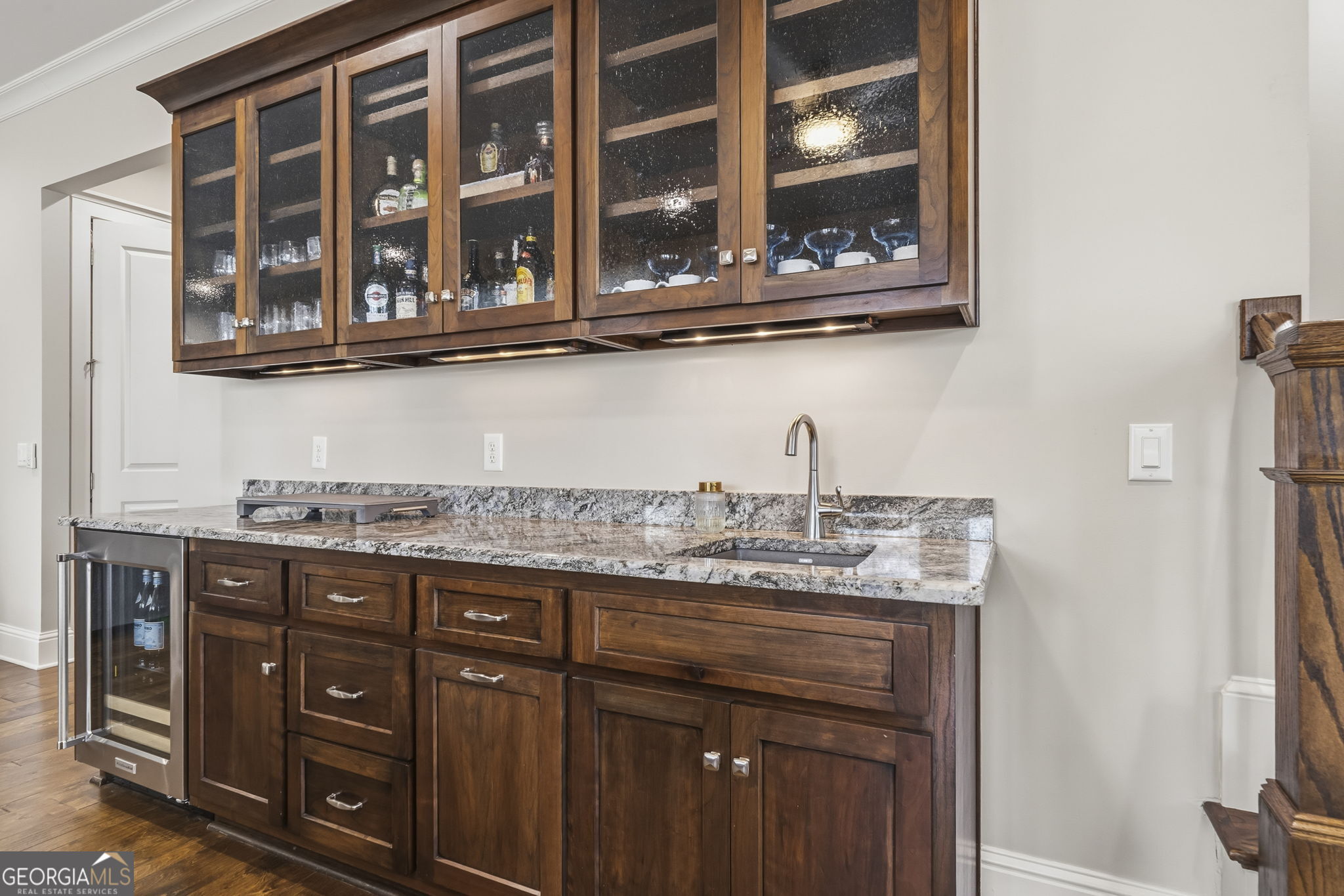 1060 Rdg Grv Court Greensboro, GA 30642 - Photo 39 of 68 a kitchen with stainless steel appliances granite countertop a sink and wooden cabinets