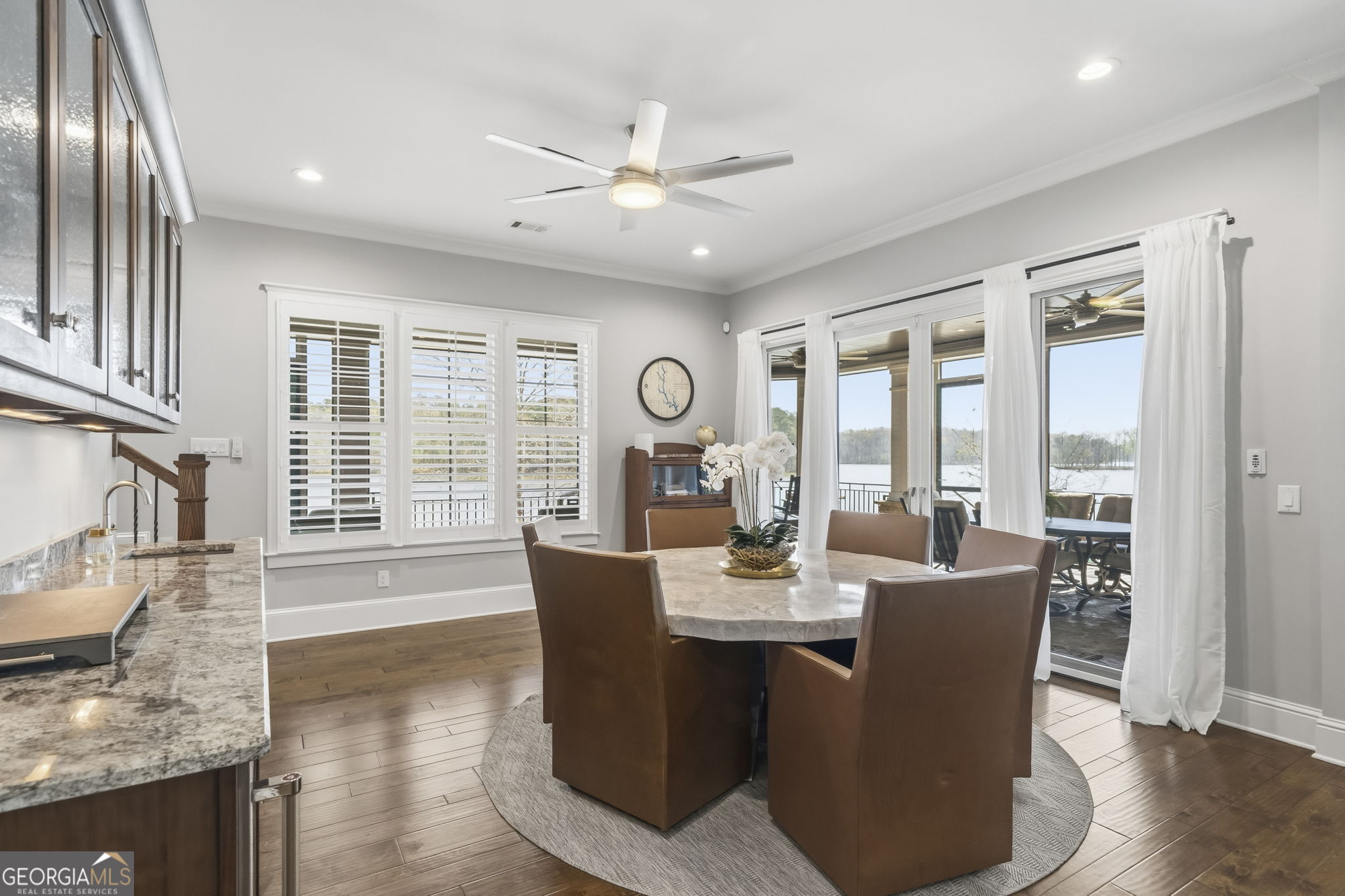 1060 Rdg Grv Court Greensboro, GA 30642 - Photo 40 of 68 a view of a dining room with furniture wooden floor and chandelier