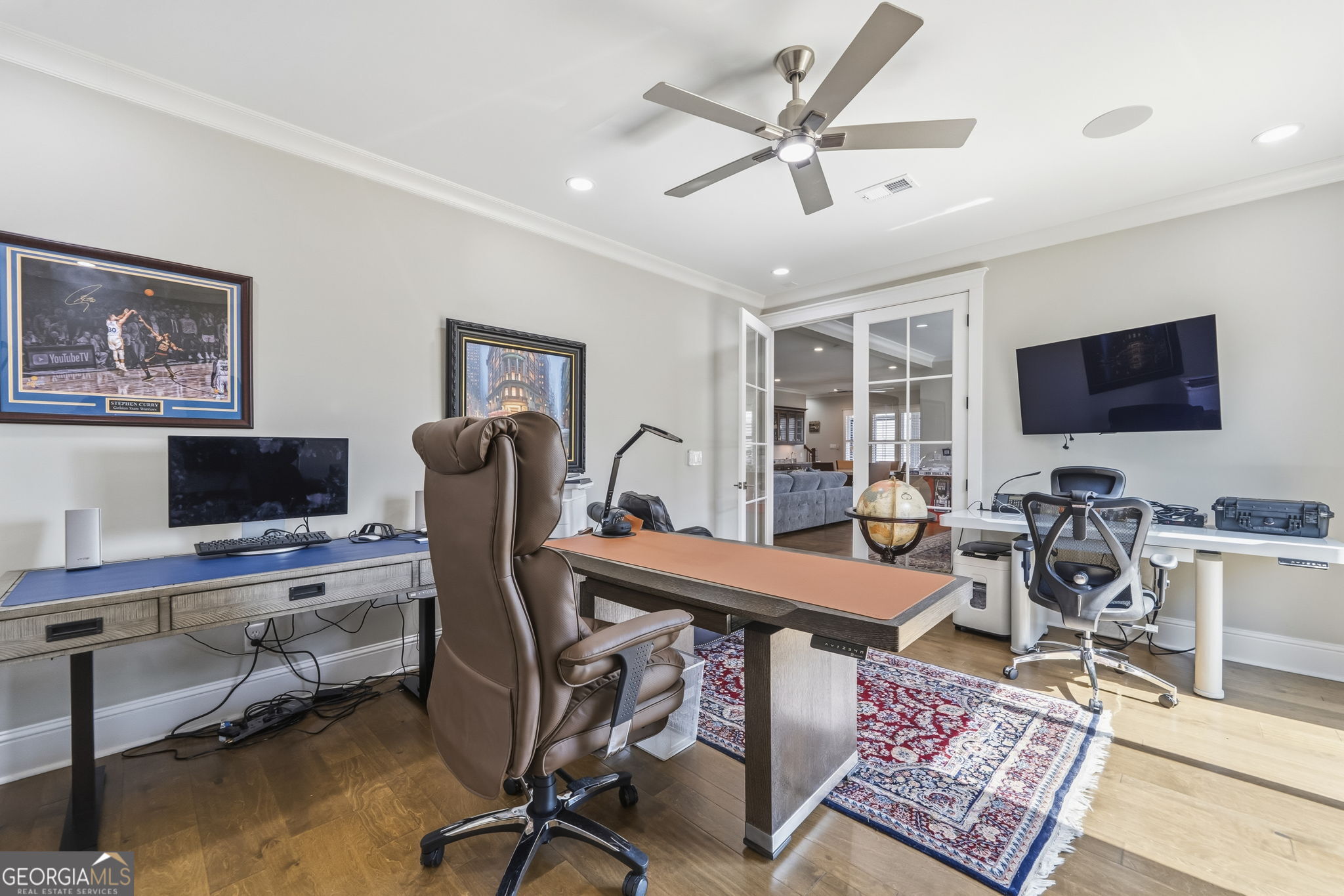 1060 Rdg Grv Court Greensboro, GA 30642 - Photo 48 of 68 a view of a workspace with furniture and a flat screen tv