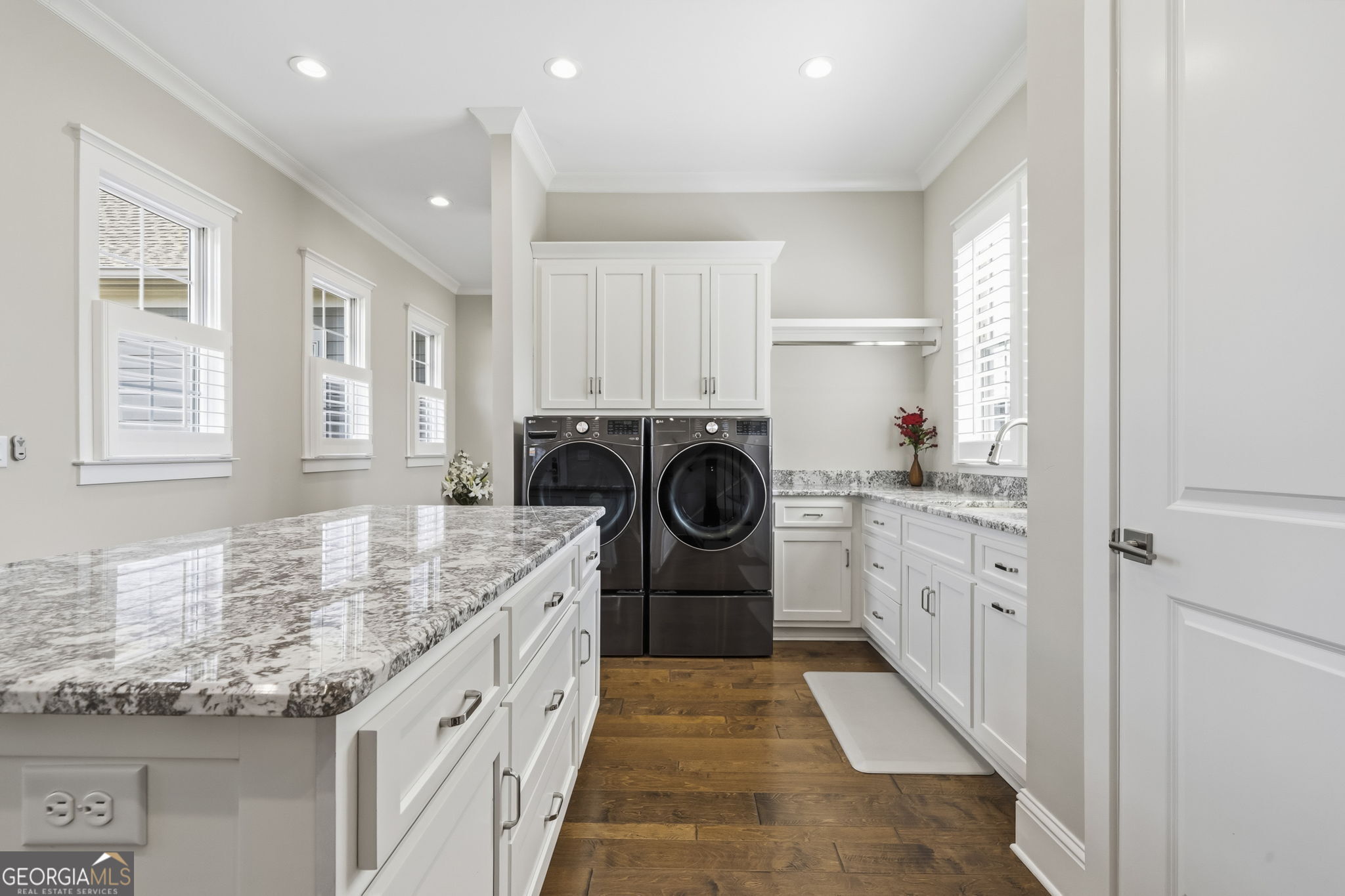 1060 Rdg Grv Court Greensboro, GA 30642 - Photo 53 of 68 a kitchen with granite countertop cabinets a sink stainless steel appliances and a window