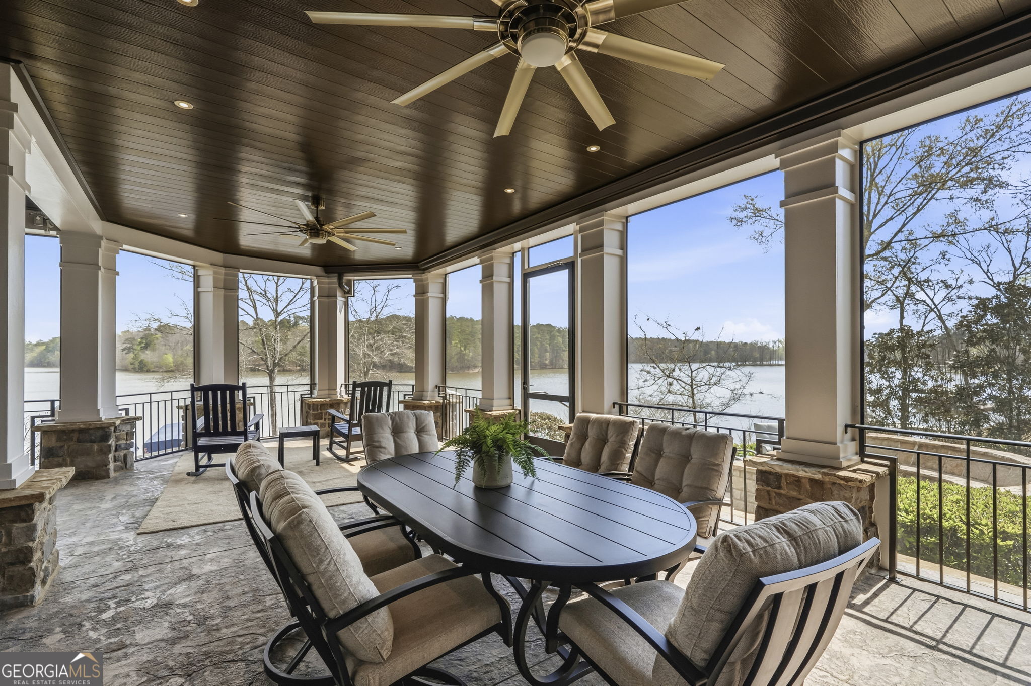 1060 Rdg Grv Court Greensboro, GA 30642 - Photo 58 of 68 a dining room with furniture large windows and a chandelier