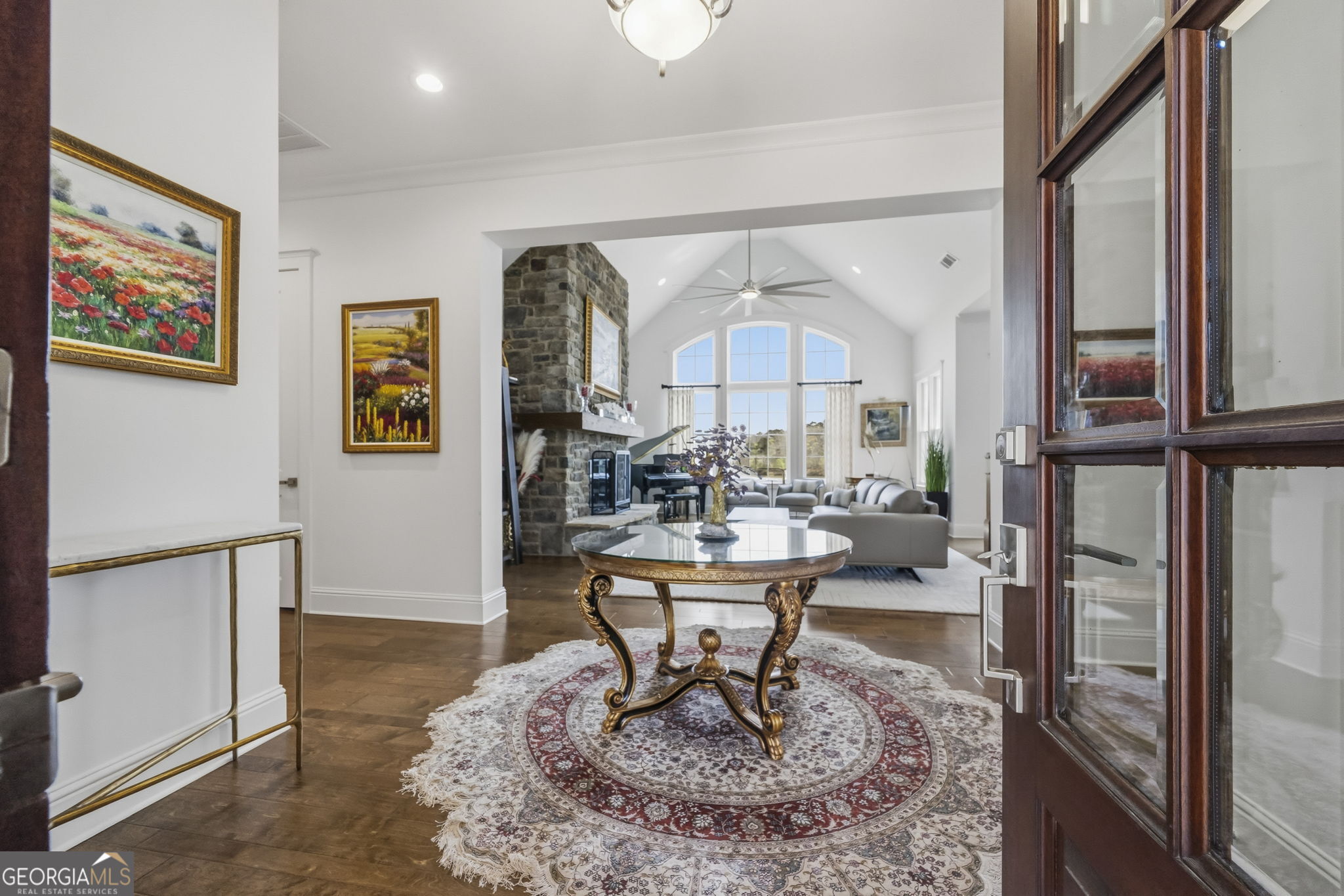 1060 Rdg Grv Court Greensboro, GA 30642 - Photo 6 of 68 a living room with fireplace furniture a rug and a large window