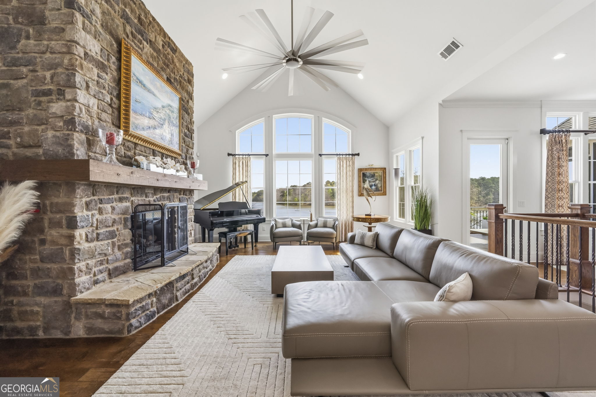 1060 Rdg Grv Court Greensboro, GA 30642 - Photo 8 of 68 a living room with furniture a fireplace and a chandelier