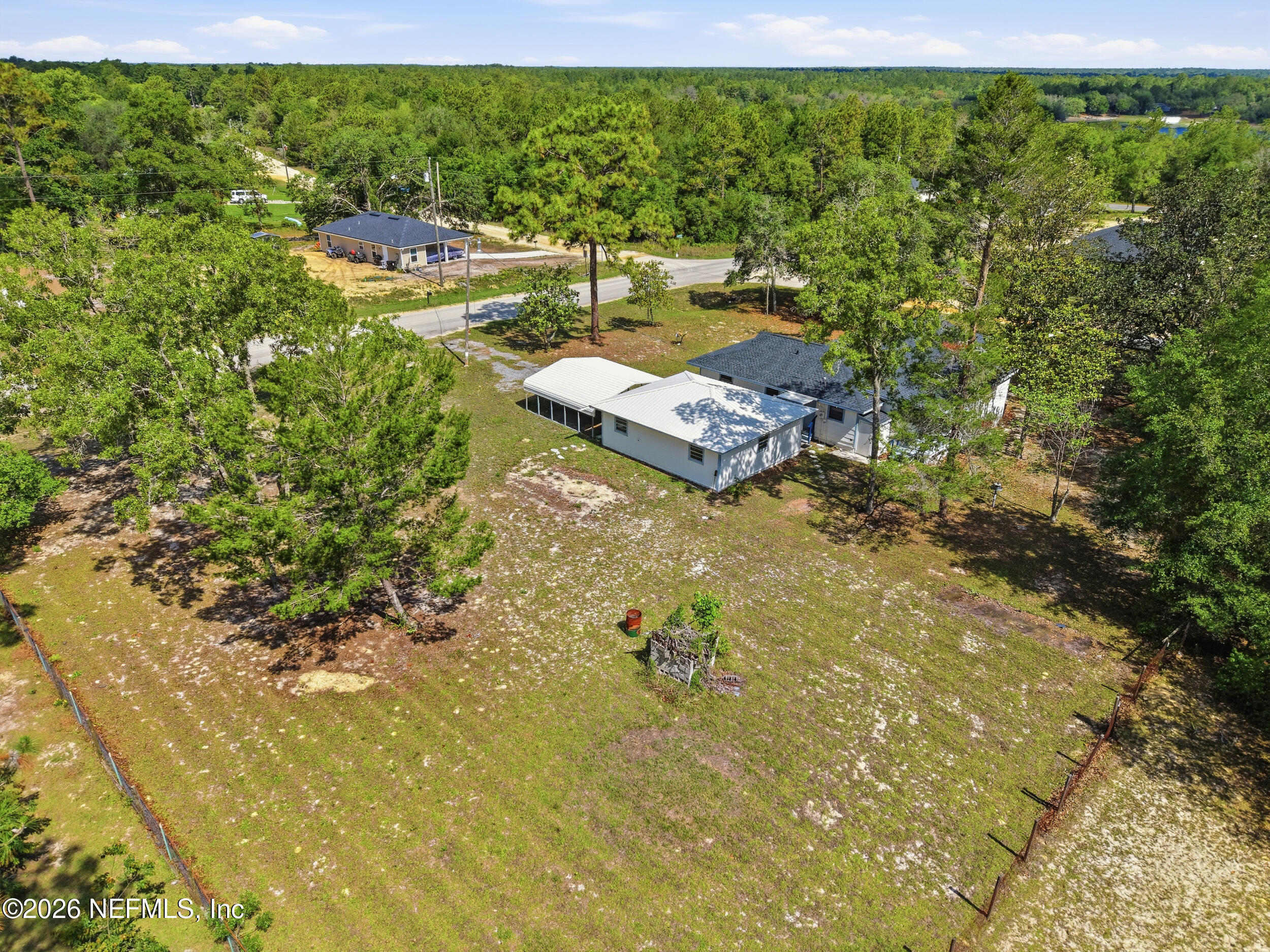 7593 Silver Sands Road Keystone Heights, FL 32656 - Photo 31 of 36 a view of a lake with houses