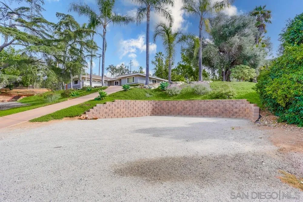 a view of road with a small yard