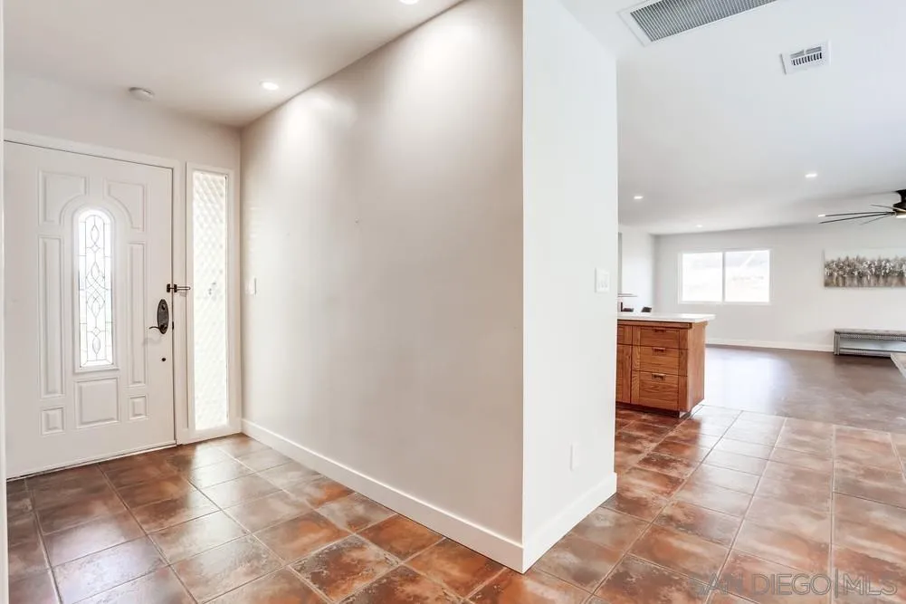 1839 Kent Place Vista, CA 92084 - Photo 12 of 40 a view of a hallway with a kitchen