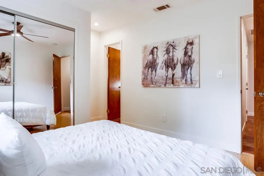 1839 Kent Place Vista, CA 92084 - Photo 27 of 40 a bedroom with a bed and a painting on the wall