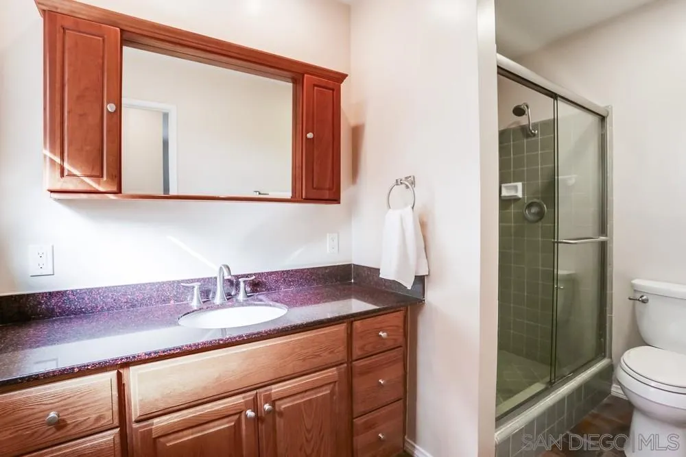 1839 Kent Place Vista, CA 92084 - Photo 28 of 40 a bathroom with a sink a toilet and shower