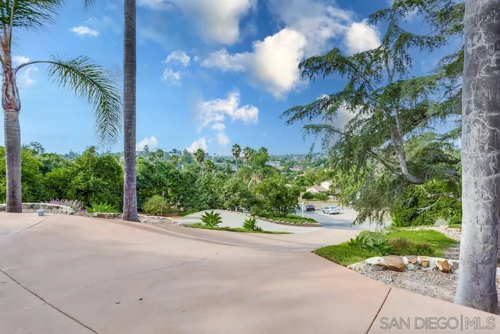 1839 Kent Place Vista, CA 92084 - Photo 3 of 40 a view of a garden with a building in the background