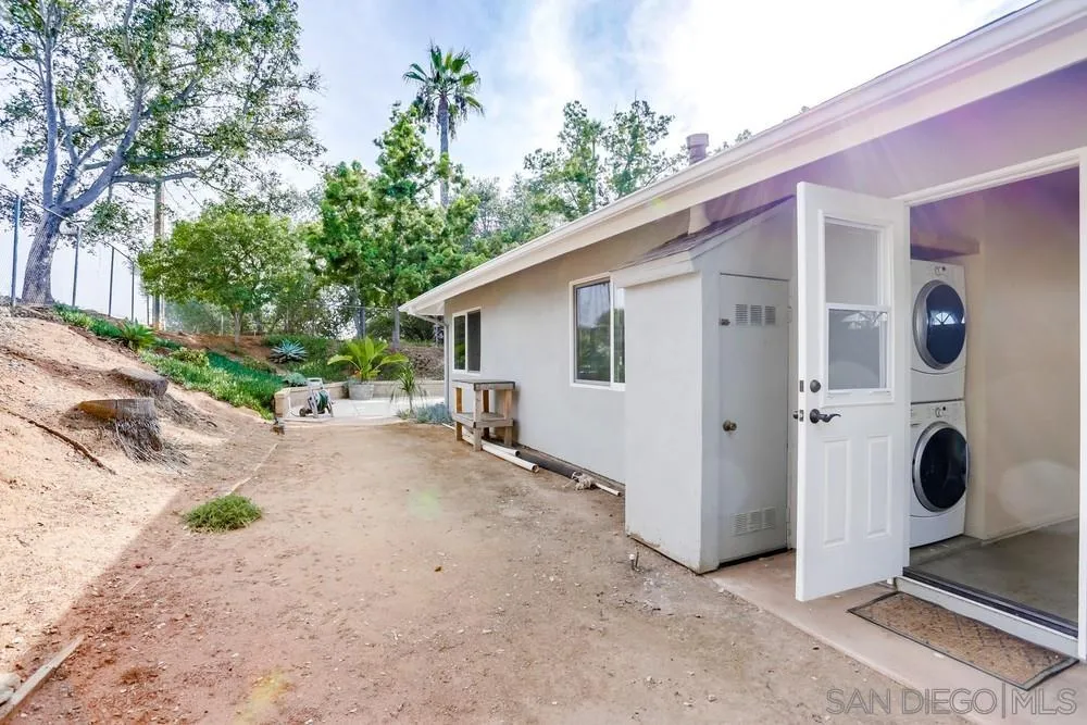 1839 Kent Place Vista, CA 92084 - Photo 31 of 40 a view of a house with backyard and trees